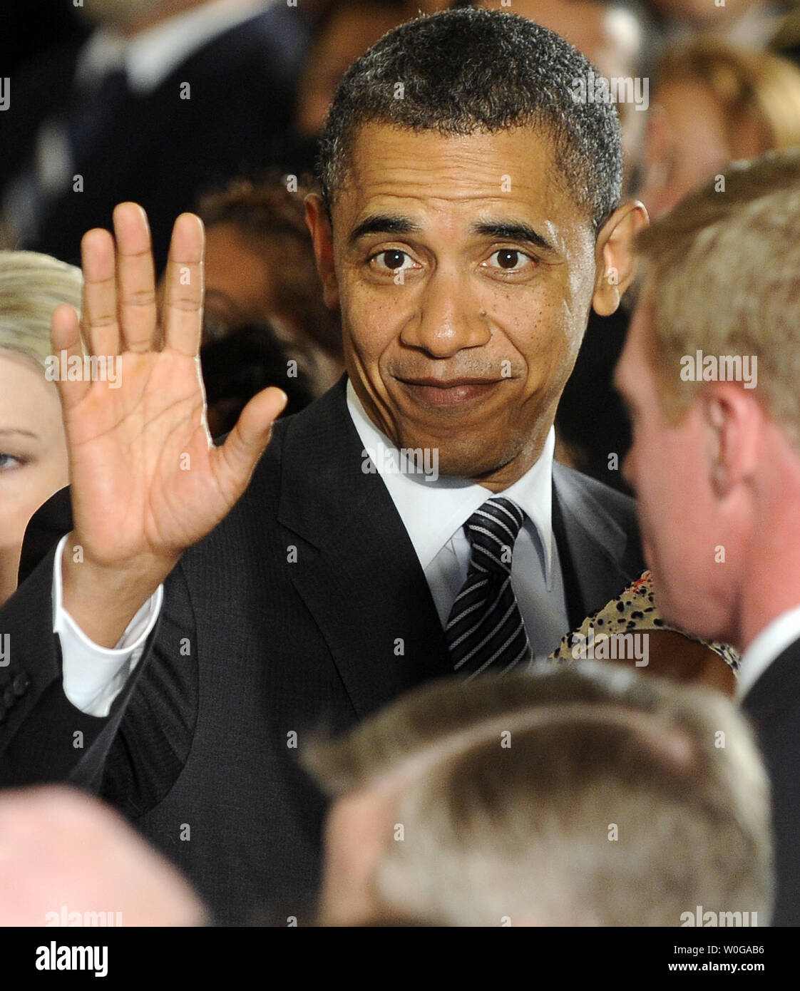 U.S. President Barack Obama greets guests after a ceremony to ...