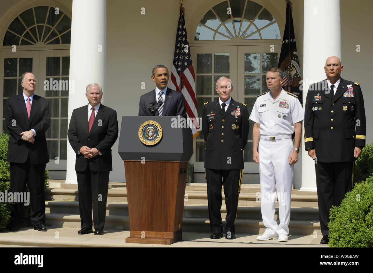 U.S. President Barack Obama makes remarks as he announces the nomination of Army Gen. Martin E. Dempsey (3rd,R) as chairman of the Joint Chiefs of Staff, May 30, 2011 in the Rose Garden of the White House, in Washington, D.C. Also attending (L-R) National Security Advisor Tom Donilon, Defense Secretary Robert Gates, Adm. James Alexander 'Sandy' Winnefeld, Jr. and Gen. Raymond Odierno. Dempsey, who will replace out-going Adm. Mike Mullen, will be the military's highest ranking officer and oversee the drawdowns in Iraq and Afghanistan, defense budget cuts and the future role of the armed forces. Stock Photo