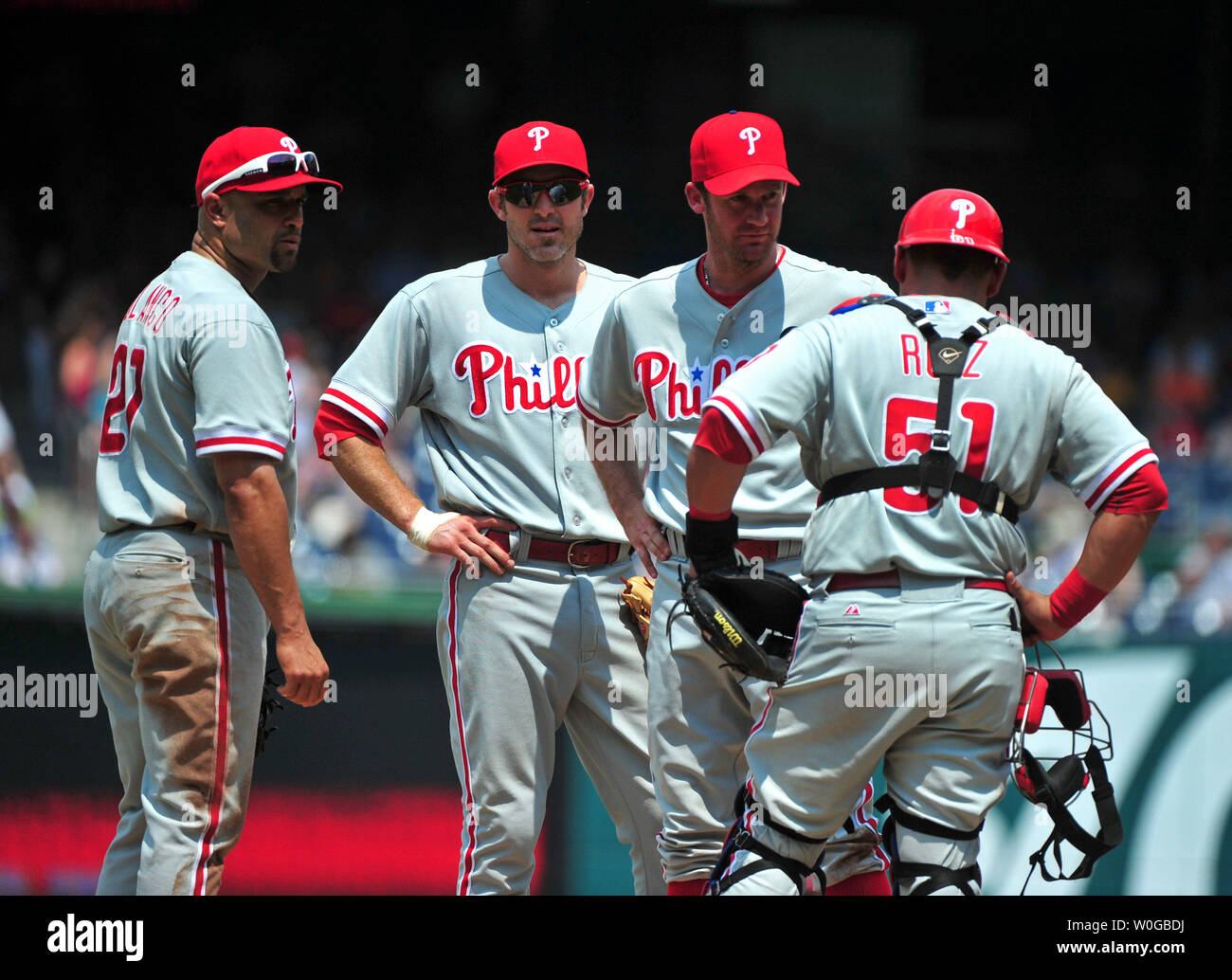 Philadelphia Phillies pitcher Roy Oswalt meets on the mound with