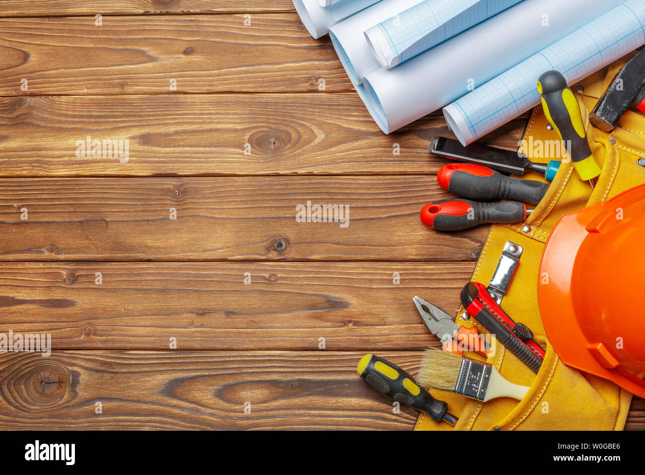 Assorted work tools on wooden table Stock Photo
