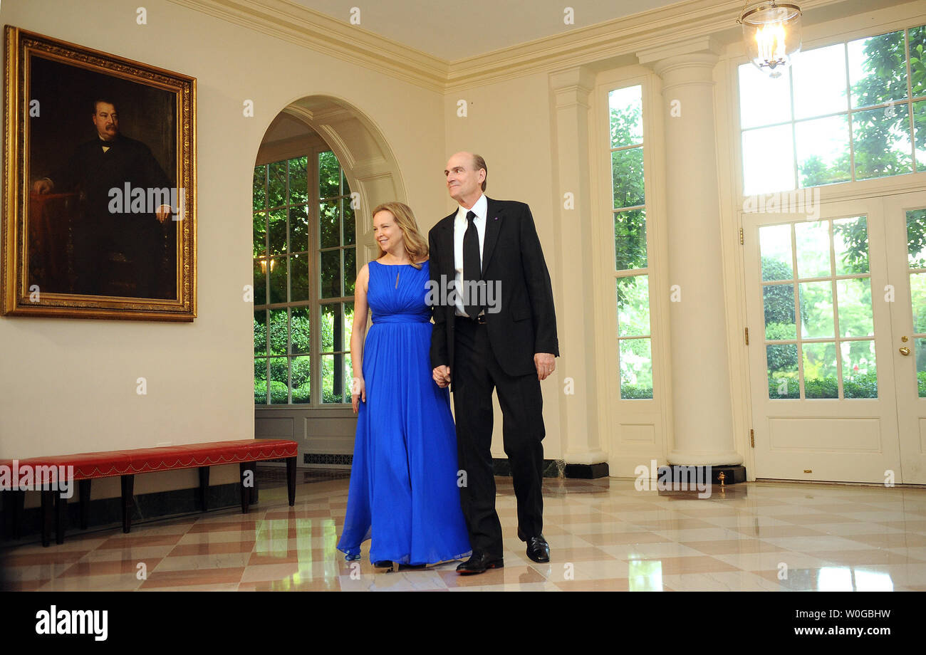 James Taylor and his wife Caroline arrive for a State Dinner in honor of German Chancellor Angela Merkel at the White House in Washington, DC, on June 7, 2011.     UPI/Roger L. Wollenberg Stock Photo