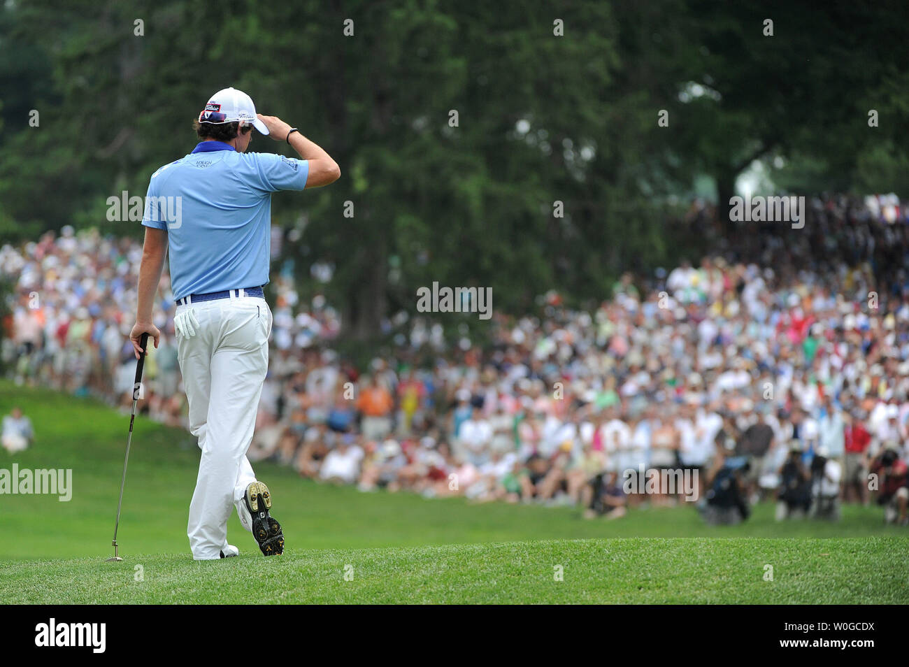 Northern Ireland's Rory McIlroy waits on the 6th green during the final  round of the 2011 U.S. Open golf championship at Congressional Country Club  in Bethesda, Maryland on June 19, 2011. McIlroy