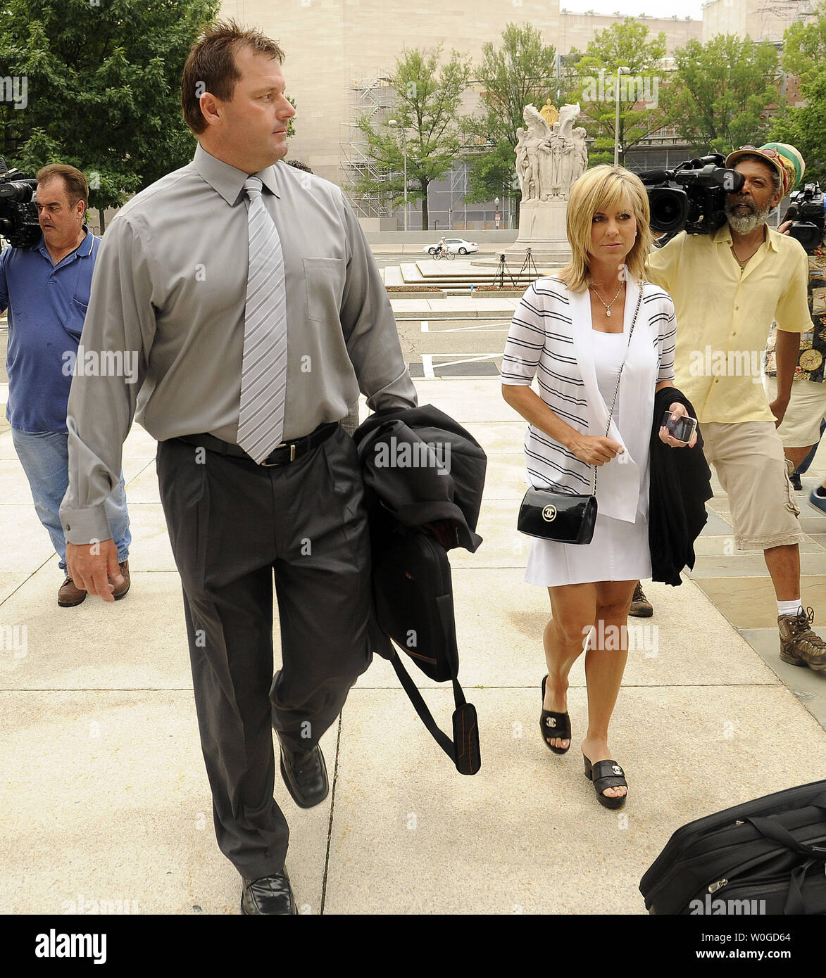 Former NY Yankees Pitcher Roger Clemens arrives with his wife Debbie at  Federal court for jury selection in his perjury trial in Washington, DC, on  July 6, 2011. Clemens is accused to