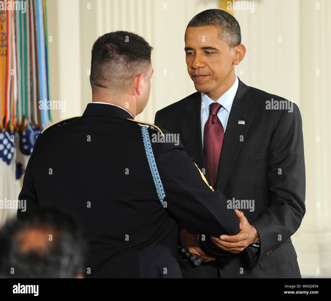Army Sgt. 1st Class Leroy Arthur Petry applauds during a ceremony at the  White House in
