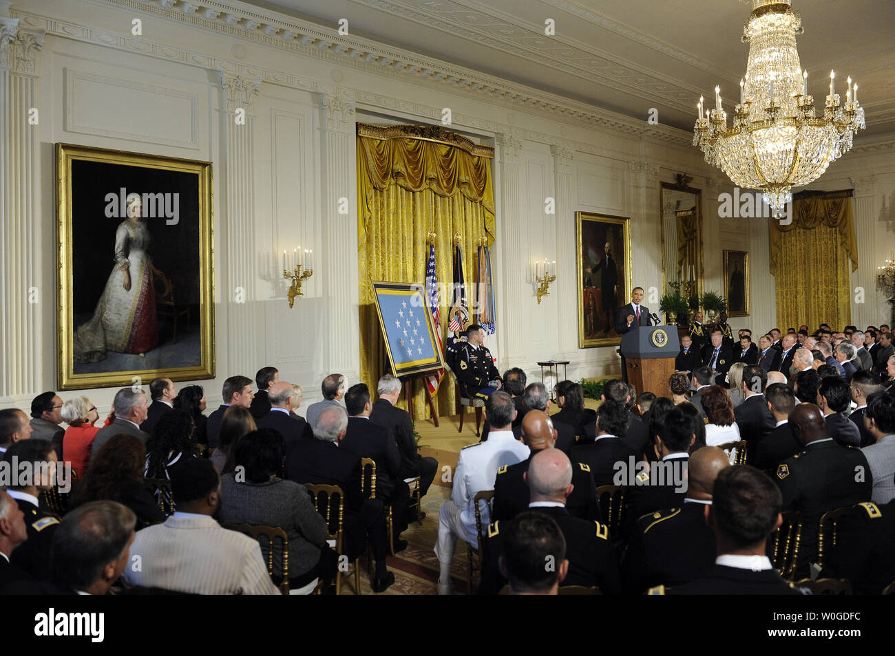 Army Sgt. 1st Class Leroy Arthur Petry applauds during a ceremony at the  White House in