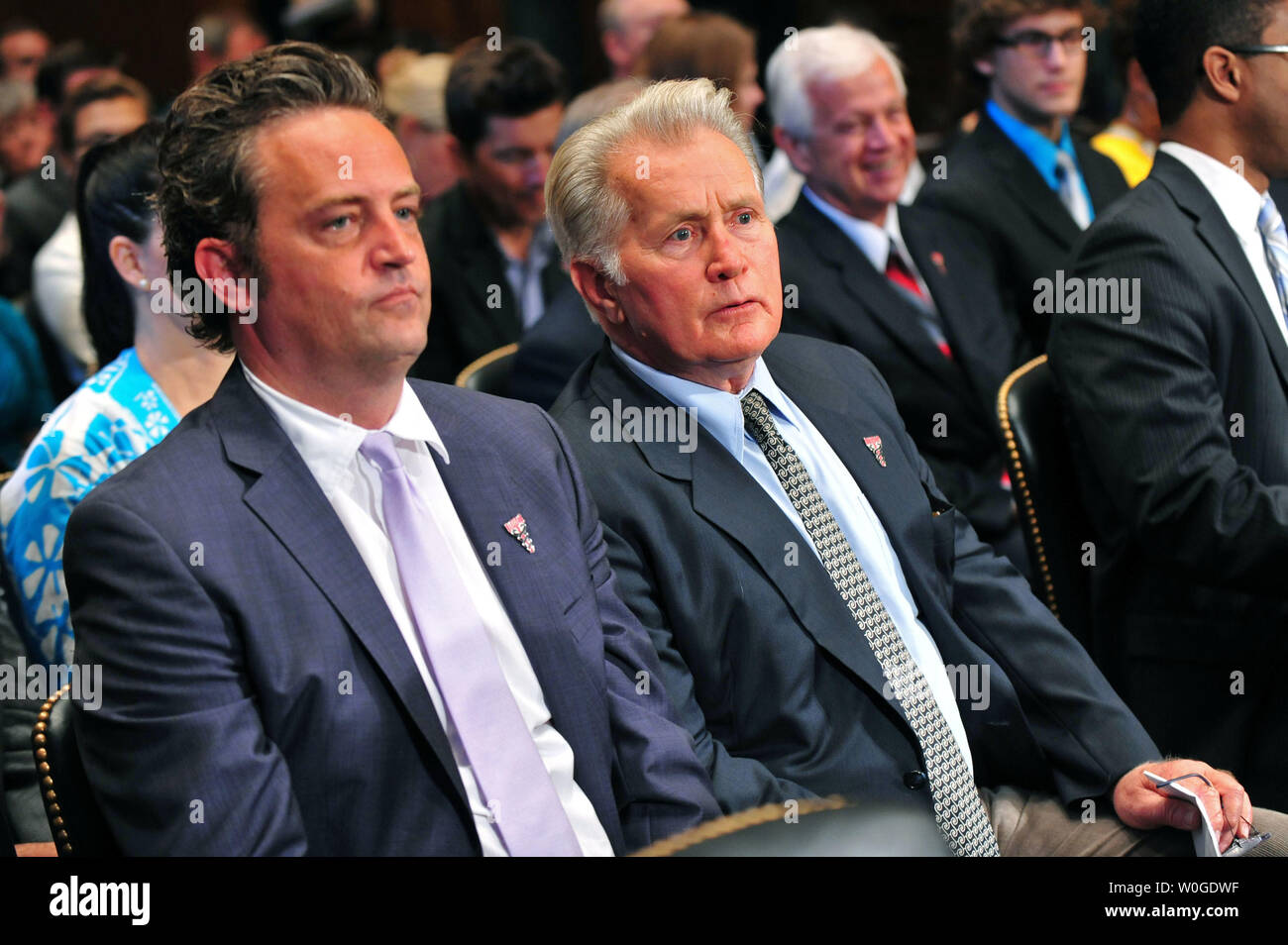 Actor Matthew Perry sits next to actor Martin Sheen during a Senate Judiciary Committee Crime and Judiciary Subcommittee hearing titled 'Drug and Veterans Treatment Courts: Seeking Cost-Effective Solutions for Protecting Public Safety and Reducing Recidivism,' on Capitol Hill in Washington, D.C. on July 19, 2011.  UPI/Kevin Dietsch Stock Photo