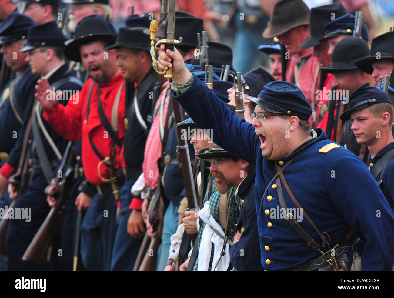 A Union commander leads his troops into battle during the reenactment ...