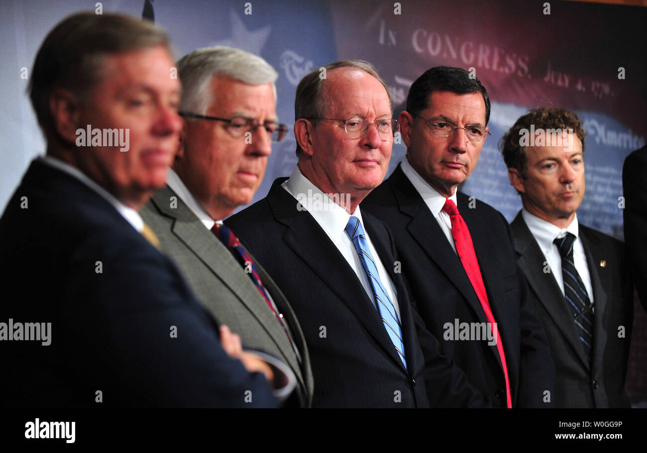 From left to right, Sen. Lindsey Graham (R-SC), Sen. Mike Enzi (R-WY), Sen. Lamar Alexander (R-TN) Sen. John Barrasso (R-WY) and Sen. Ran Paul (R-KY) attends a media availability to discuss the National Labor Relations Board and regulations hindering job growth in Washington on September 14, 2011. UPI/Kevin Dietsch Stock Photo