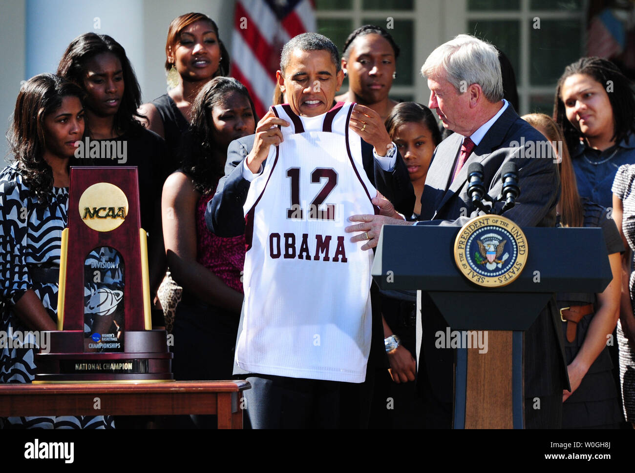 President Barack Obama receives a jersey from the Pittsburgh Penguins  during a ceremony to honor them for their 2009 Stanley Cup championship  victory on September 10, 2009 in Washington, DC, USA on