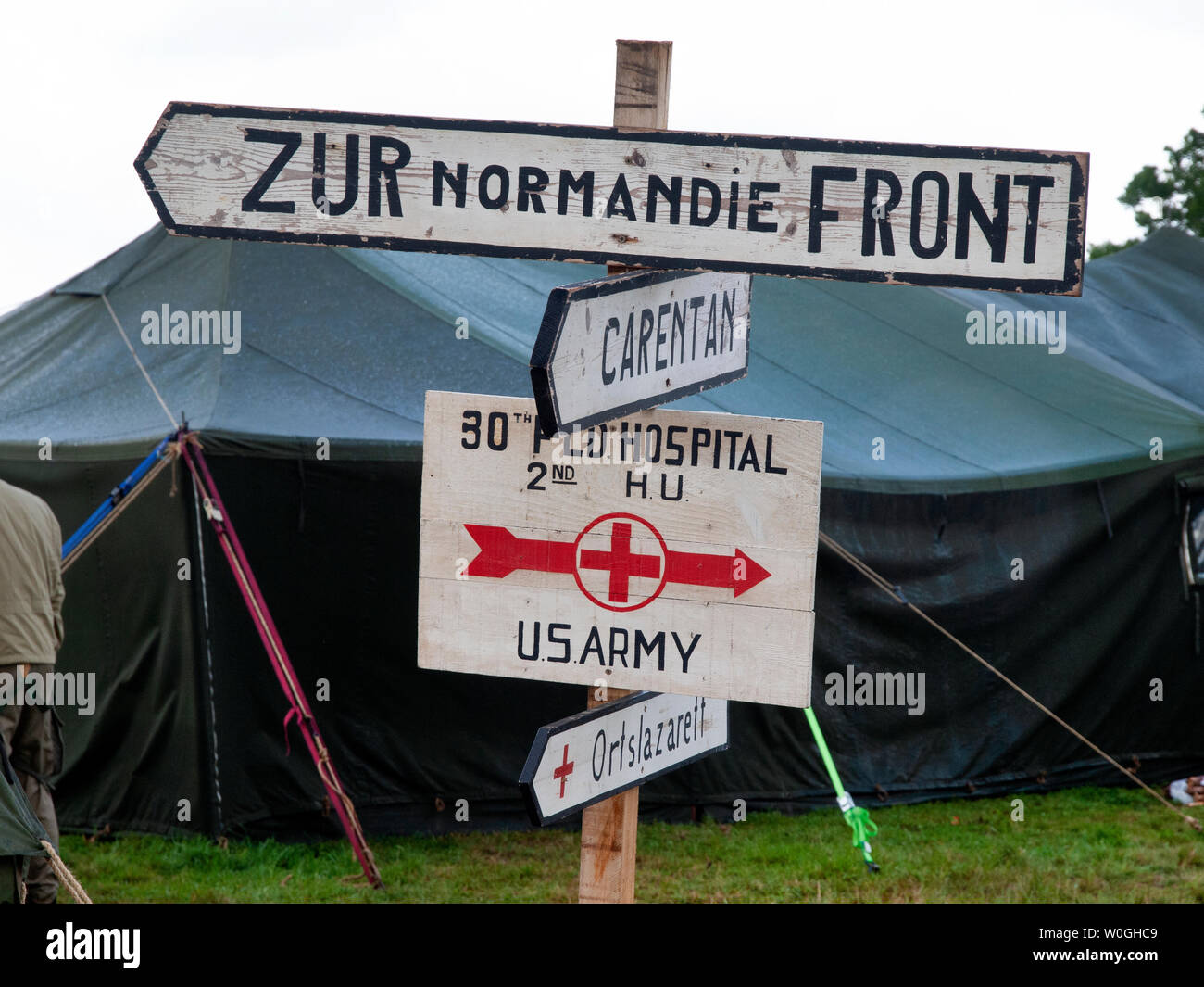 Signposts at a recreation of a U.S. Army camp for the remembrance of the D-Day invasion and liberation of France Stock Photo