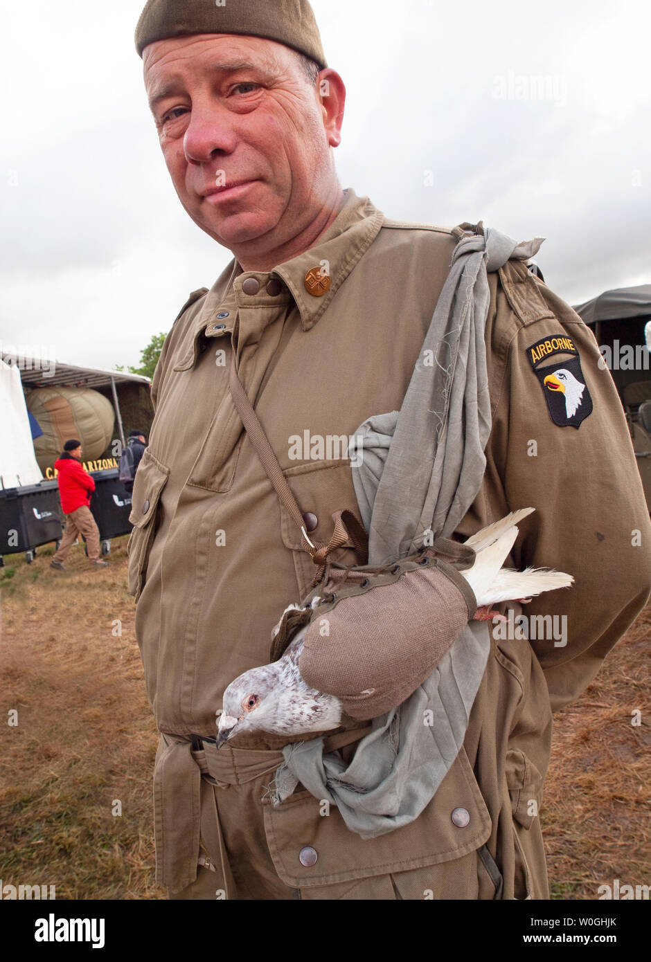 A D-Day historical reenactment enthusiast with a carrier pigeon Stock Photo