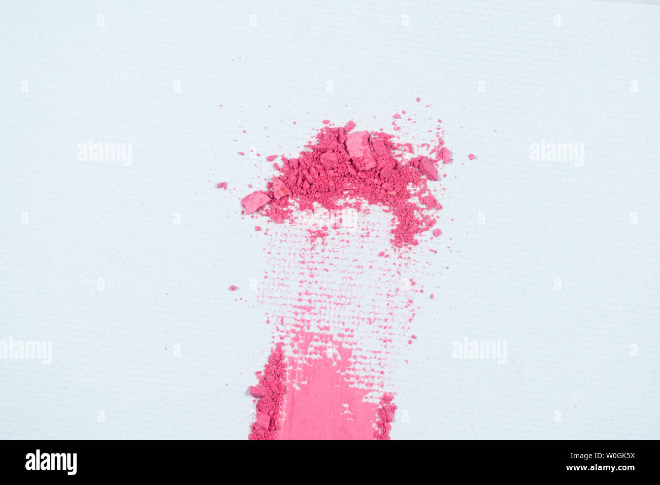 Eye shadow or bronzer pink smudge on white background. Stock Photo