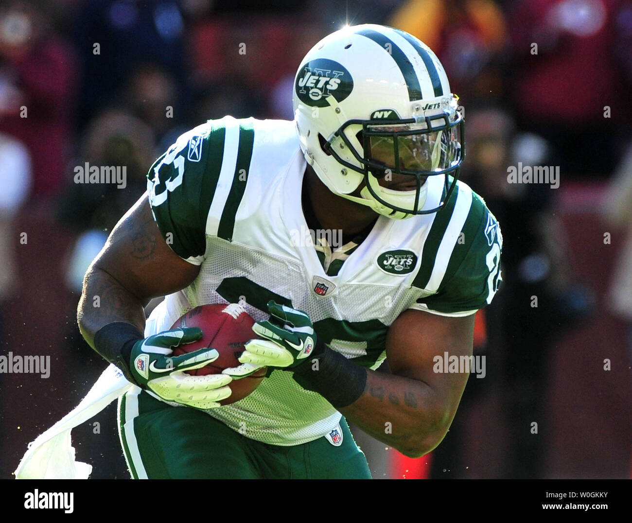 New York Jets' running back Shonn Greene runs over Pittsburgh Steelers'  Ryan Clark as he goes for a first down during the AFC Championship at Heinz  Field in Pittsburgh, Pennsylvania on January