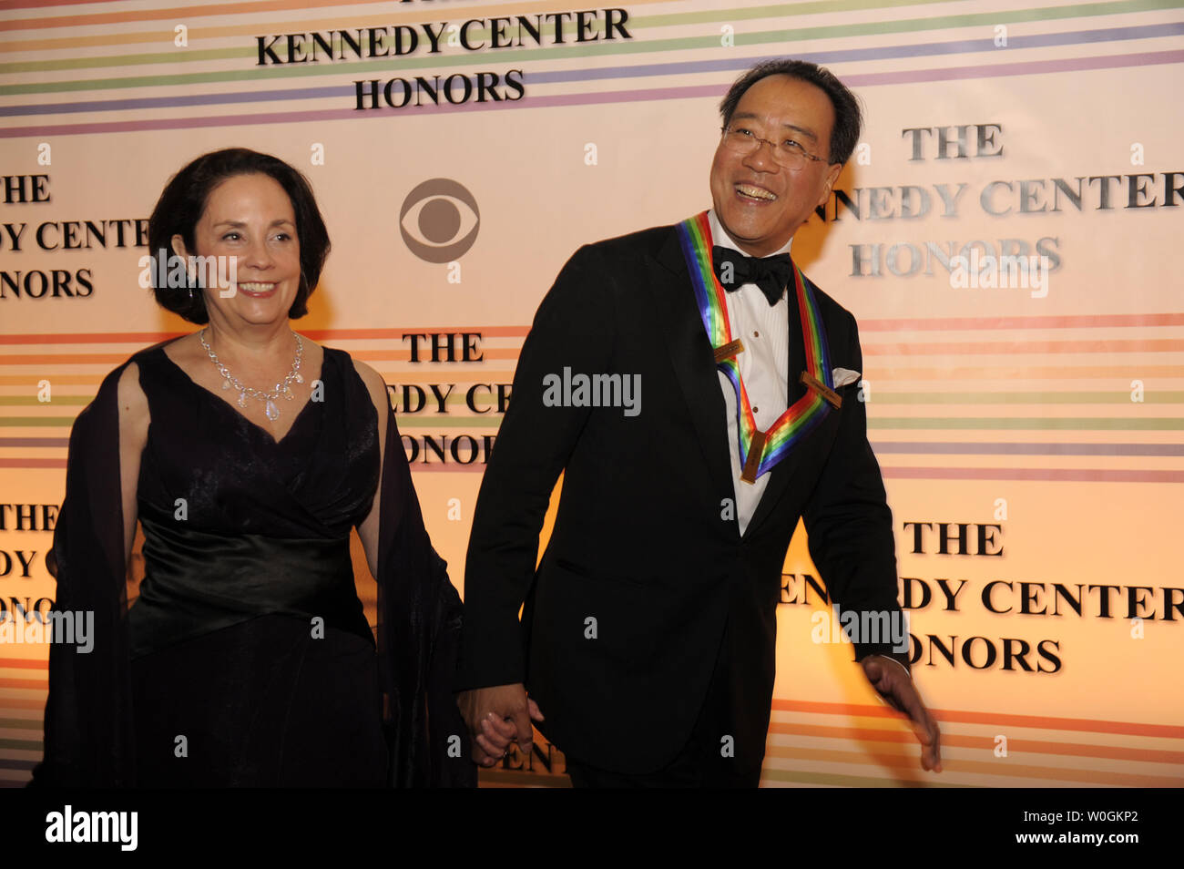 2011 Kennedy Center Honoree and Grammy Award-winning cellist Yo-Yo Ma, 56,  and his wife Jill Horner Academy greet photographers on the red carpet as  they arrive at the Kennedy Center for the