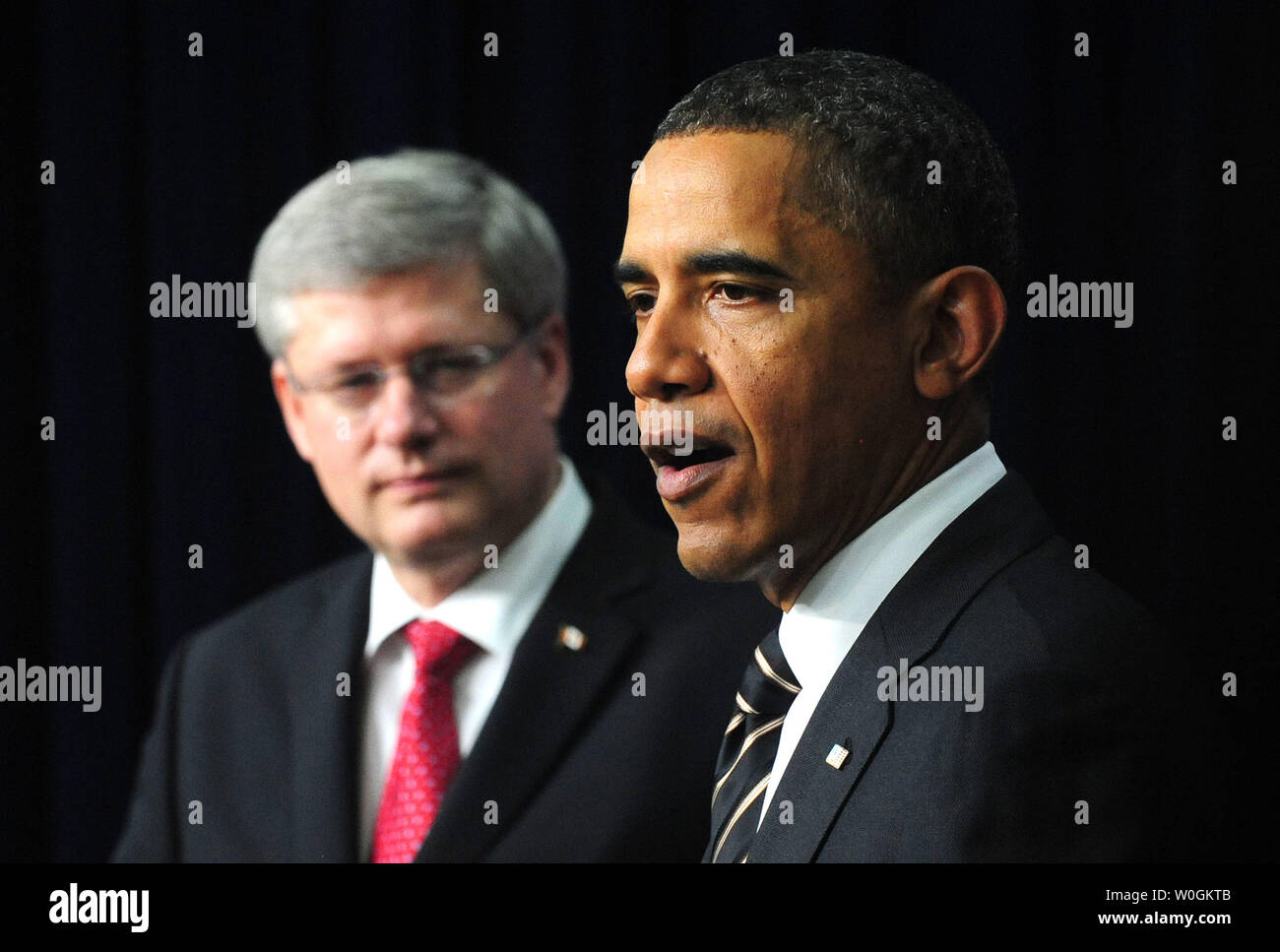 U.S. President Barack Obama speaks alongside Canadian Prime Minister Stephen Harper during a joint press statement in the Eisenhower Executive Office Building in Washington on December 7, 2011. The two leaders announced their countries would ease restrictions on trade and travel.  UPI/Kevin Dietsch Stock Photo