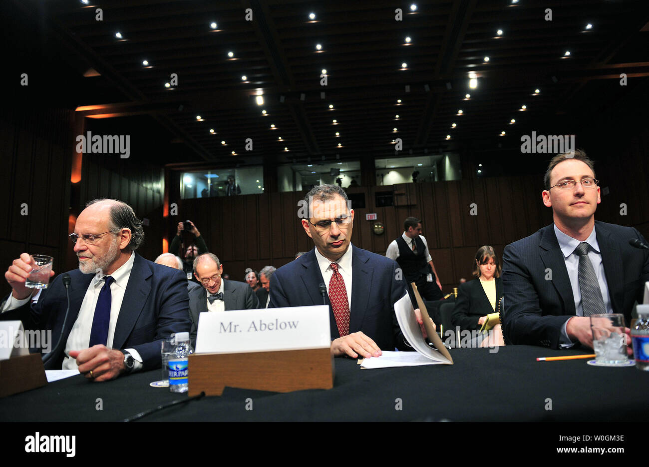 Former Gov. Jon Corzine (L), D-N.J., former chairman and CEO of MF Global;  Bradley Abelow (C), president and COO of MF Global' and Henri Steenkamp, CFO of MF Global testify during a Senate Agriculture, Nutrition and Forestry Committee hearing on the circumstances surrounding the bankruptcy of MF Global Holdings Ltd, on Capitol Hill in Washington, D.C. on December 13, 2011. UPI/Kevin Dietsch Stock Photo