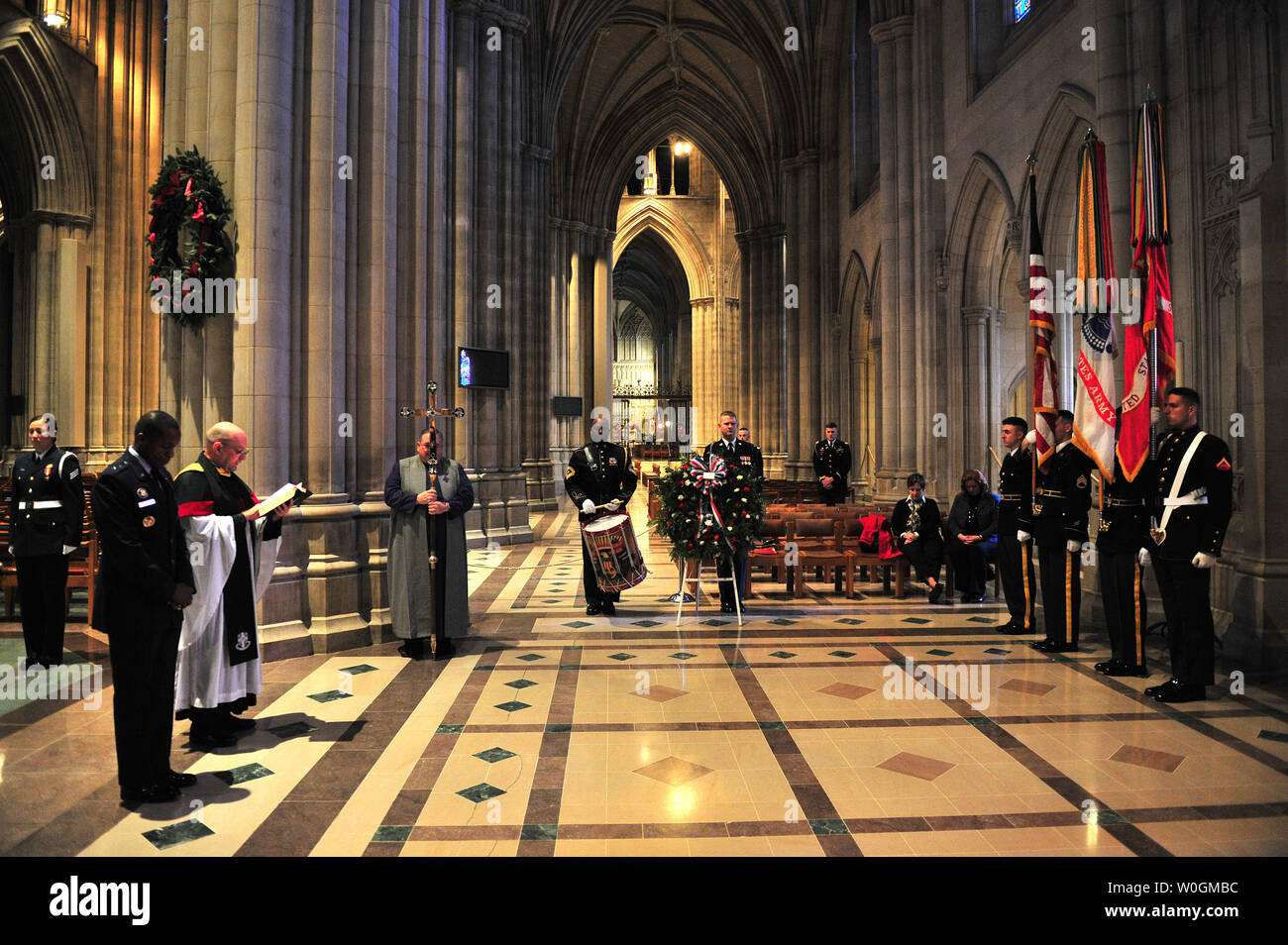 Rev. Richard Kukowski (2nd-L), Cathedral Chaplin, and Air Force Major General Darren W. McDew (L), Commander of the Air Force District of Washington, participates in a Wreath Laying Ceremony with members of an Army Honor Guard for the 156 anniversary of President Woodrow Wilson birth at his tomb at the Washington National Cathedral in Washington on December 28, 2011. UPI/Kevin Dietsch Stock Photo