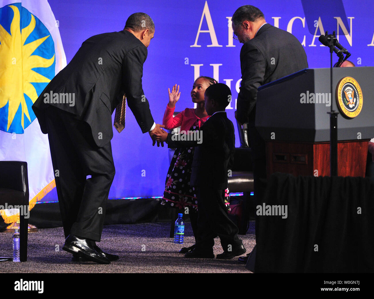 President Barack Obama greets students from the Brooklyn Montessori school at the ground breaking ceremony for the Smithsonian National Museum of African American History and Culture in Washington, D.C. on February 22, 2012. The museum is set to open in 2015. UPI/Kevin Dietsch Stock Photo