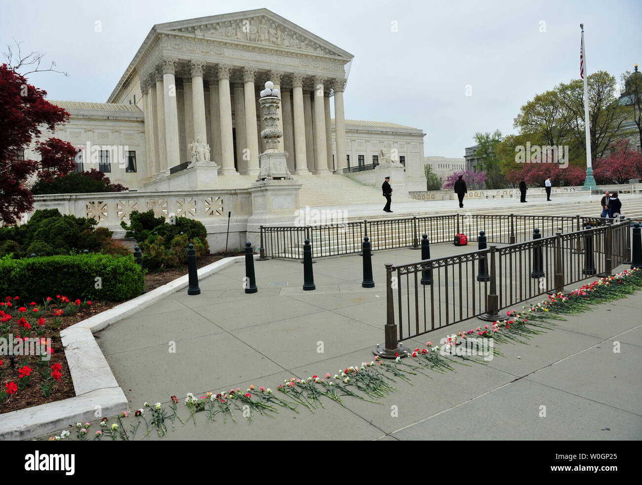 Flowers circle the United States Supreme Court during a rally against abortion a day before the Court will take up arguments on the constitutionality of President Obama's health care reform bill, in Washington, D.C. on March 25, 2012.   UPI/Kevin Dietsch Stock Photo