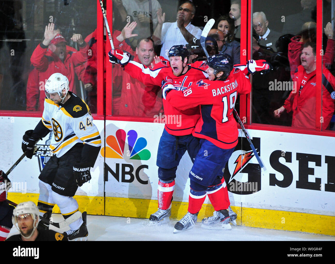 Washington Capitals Jason Chimera celebrates with teammate Nicklas Backstrom after scoring against Boston Bruins goalie Tim Thomas during the second period of game 6 of the Eastern Conference Quarterfinals against the Boston Bruins at the Verizon Center in Washington, D.C. on April 22, 2012.  UPI/Kevin Dietsch Stock Photo