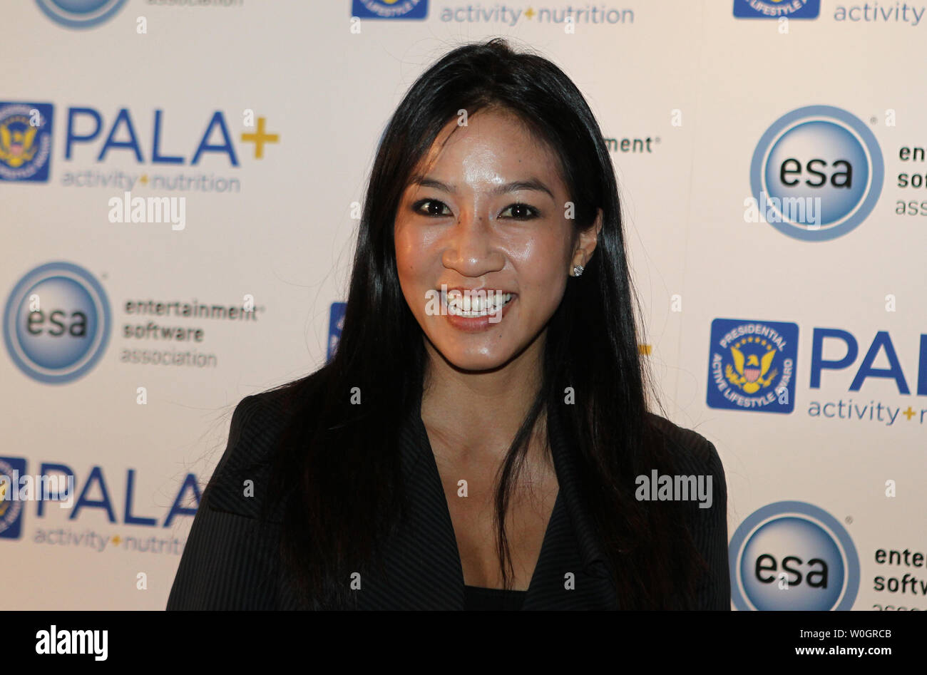 Olympian figure skater Michelle Quan poses for photographs as she