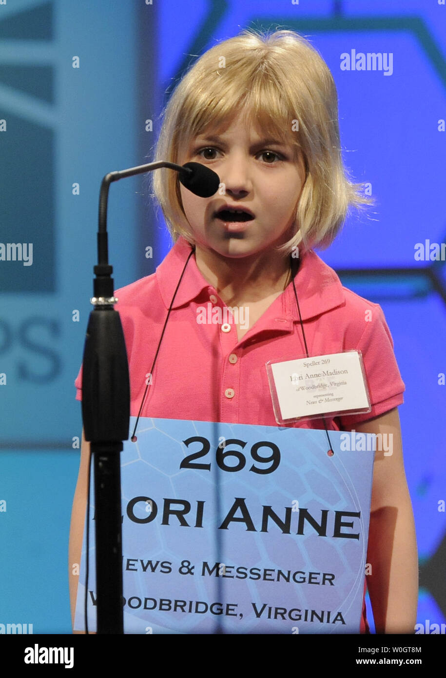 Lori Anne Madison, 6, of Woodbridge, Virginia, spells out the letters in her word as she competes during the opening round of the Scripps National Spelling Bee, May 30, 2012, in National Harbor, Maryland. Madison, the youngest known qualifier in the history of the contest, correctly spelled the word 'dirigible*', a lighter-than-air aircraft, to advance.        UPI/Mike Theiler Stock Photo