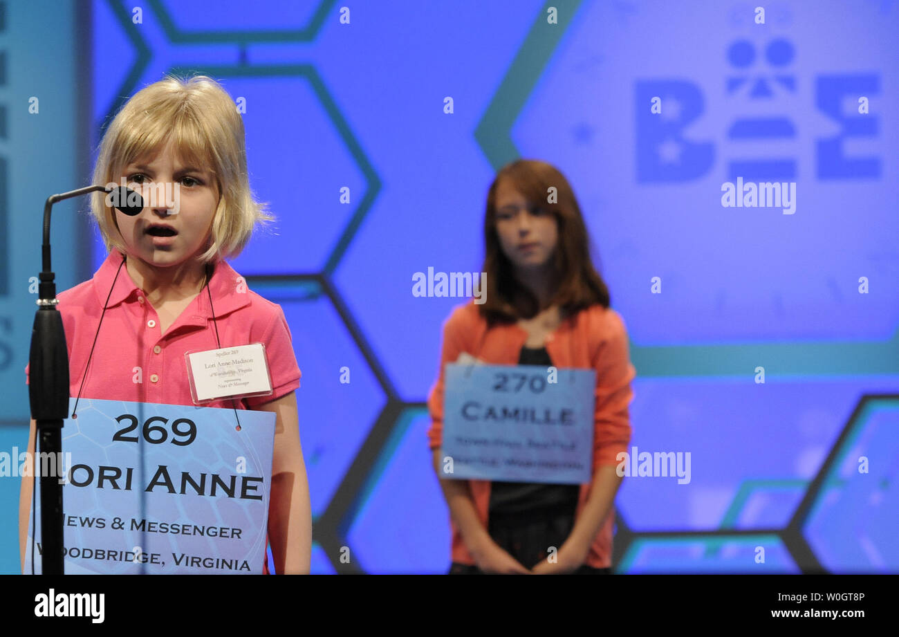 Lori Anne Madison, 6, of Woodbridge, Virginia, spells out the letters in her word as she competes during opening round of the Scripps National Spelling Bee, May 30, 2012, in National Harbor, Maryland. Madison, the youngest known qualifier in the history of the contest, correctly spelled the word 'dirigible', a lighter-than-air aircraft, to advance.        UPI/Mike Theiler Stock Photo