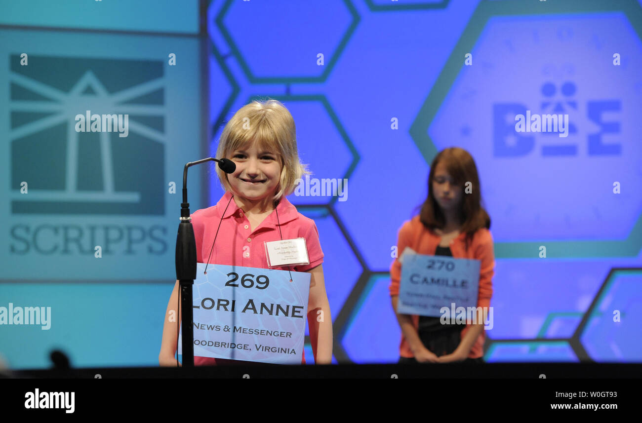 Lori Anne Madison, 6, of Woodbridge, Virginia, smiles as she listens for her word to spell, during opening round of the Scripps National Spelling Bee, May 30, 2012, in National Harbor, Maryland. Madison, the youngest known qualifier in the history of the contest, correctly spelled the word 'dirigible', a lighter-than-air aircraft, to advance.        UPI/Mike Theiler Stock Photo
