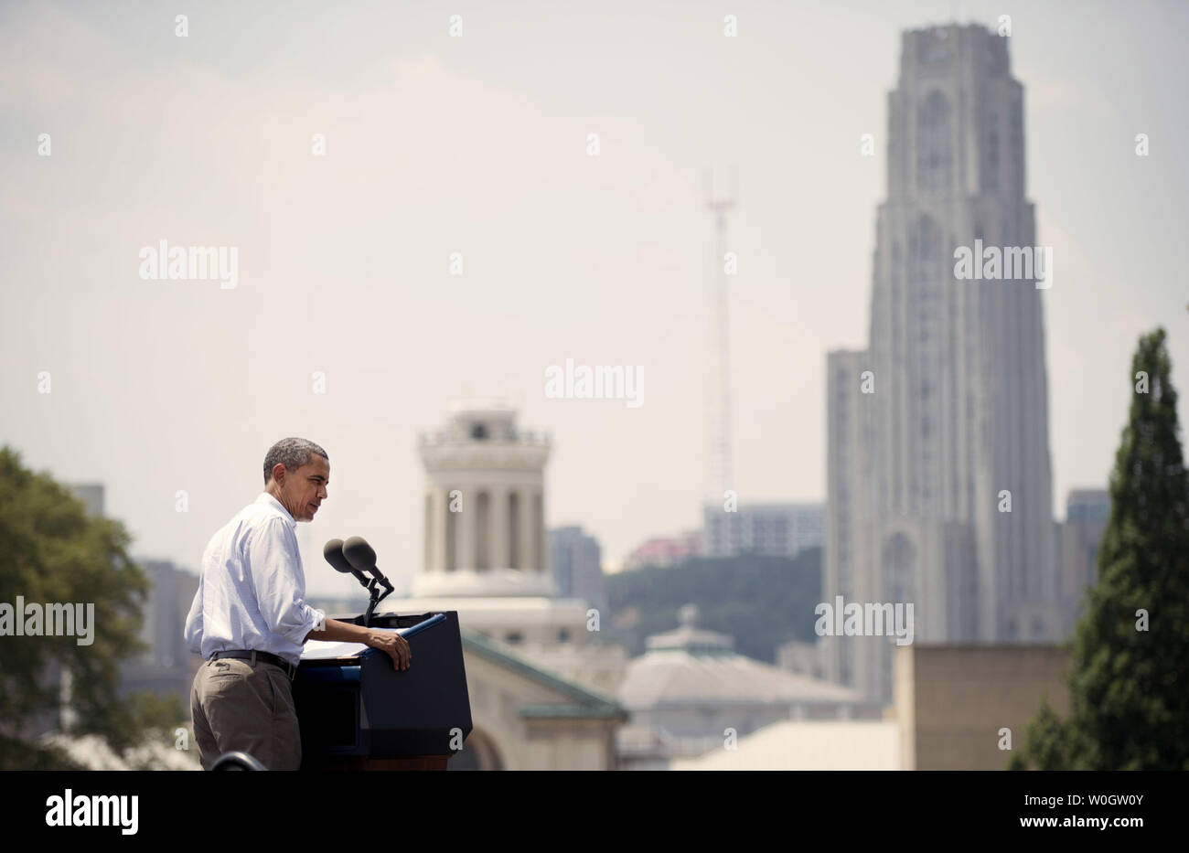President Barack Obama delivers remarks at a campaign on the campus of Carnegie Mellon University in Pittsburgh, Pennsylvania on July 6, 2012. President Obama is on the second day of his, 'Betting on America' bus tour through Ohio and Pennsylvania.  The tall building in the background is the Cathedral of Learning on the University of Pittsburgh campus.  UPI/Kevin Dietsch Stock Photo