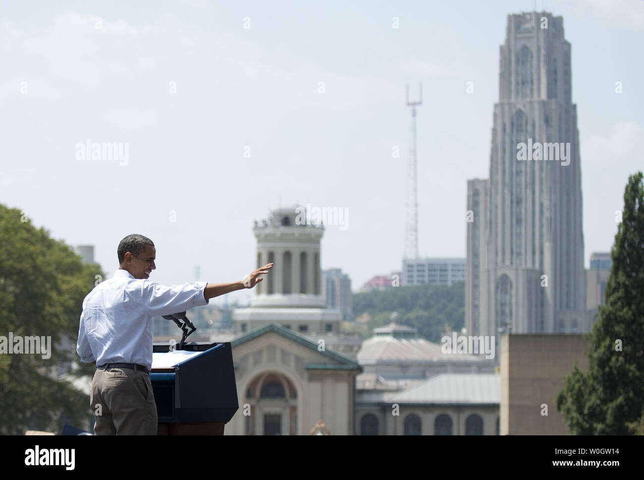 President Barack Obama delivers remarks at a campaign on the campus of Carnegie Mellon University in Pittsburgh, Pennsylvania on July 6, 2012. President Obama is on the second day of his, 'Betting on America' bus tour through Ohio and Pennsylvania.  The tall building in the background is the Cathedral of Learning on the University of Pittsburgh campus.  UPI/Kevin Dietsch Stock Photo