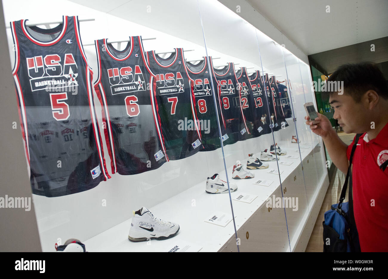 A visitor looks at USA Olympic basketball jerseys at a Nike basketball  skills camps in Washington, D.C. on July 2012. The youth clinic is part of  a USA Basketball weekend in Washington,