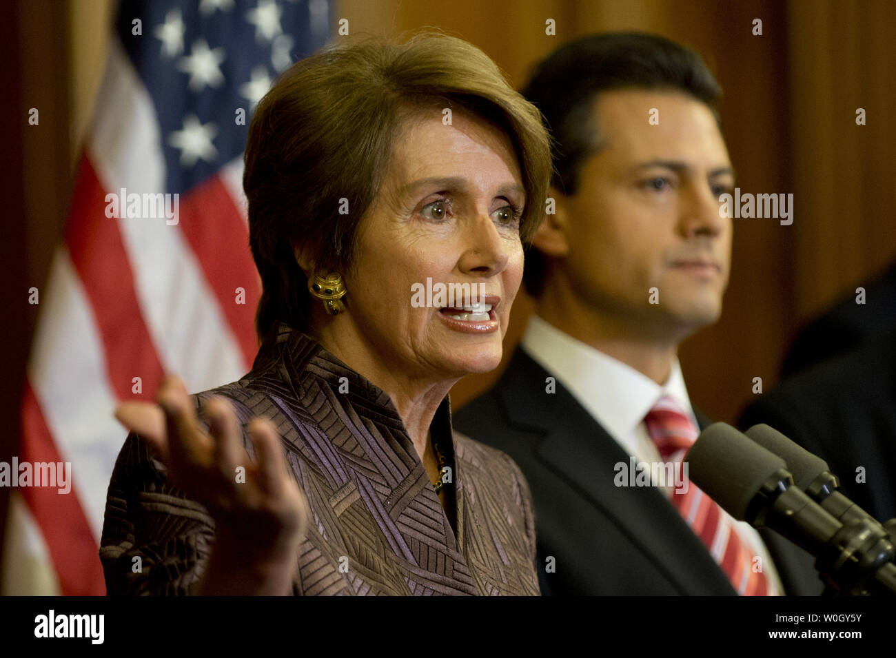 House Minority Leader Nancy Pelosi (D-CA) speaks alongside Mexican President-elect Enrique Pena Nieto during a media availability on Capitol Hill in Washington, DC on November 27, 2012.  UPI/Kevin Dietsch Stock Photo