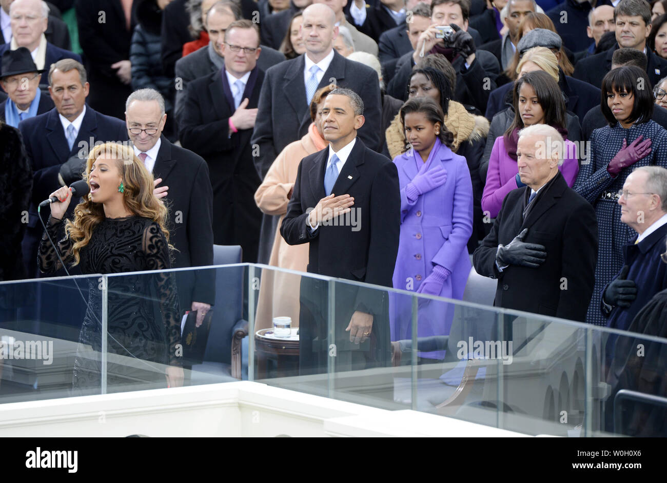 U S President Barack Obama Watches Beyonce Sing The National Anthem After He Is Sworn In For A Second Term By Supreme Court Chief Justice John Roberts During His Public Inauguration Ceremony At The