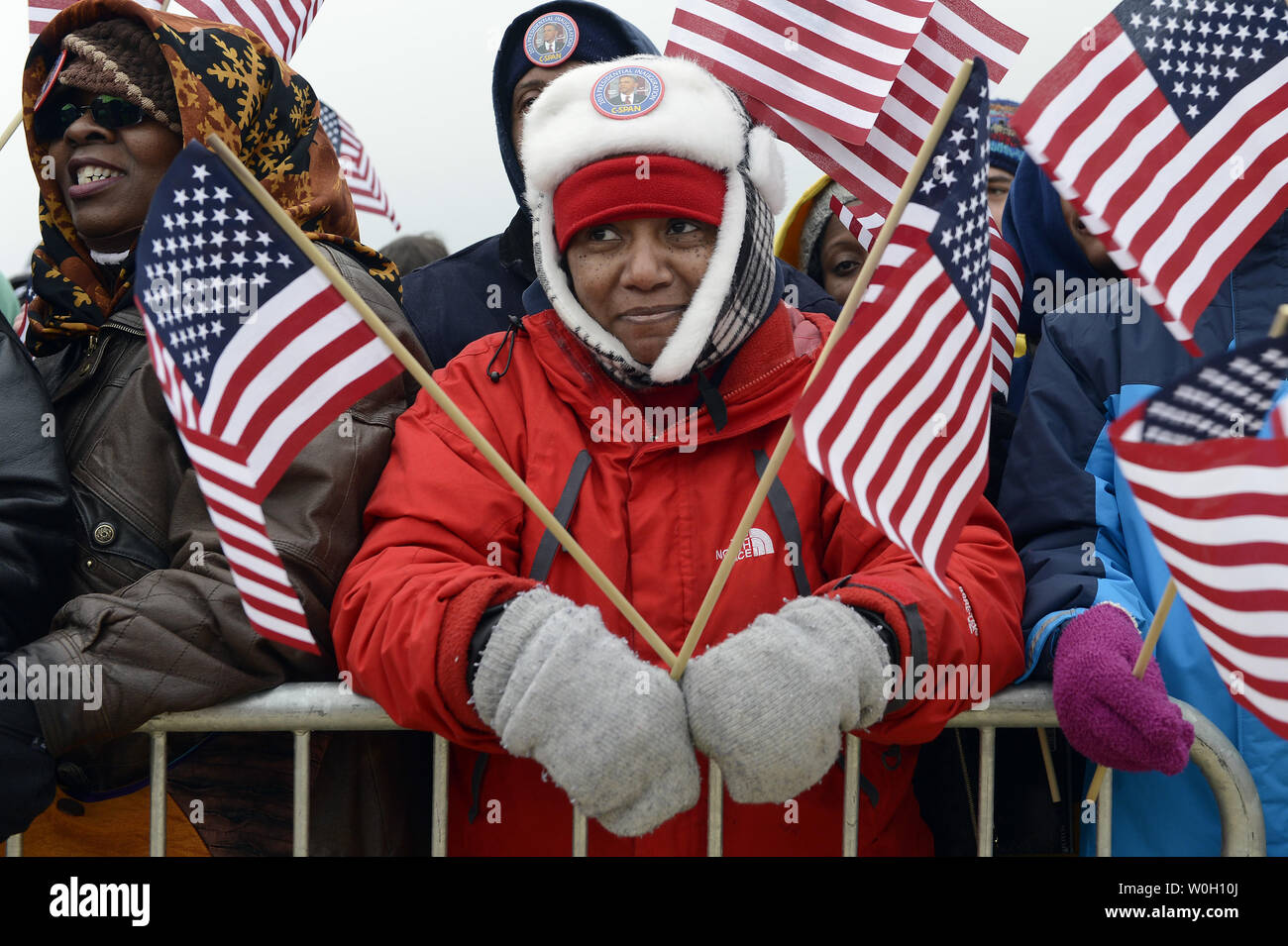 People celebrate on the National Mall as U.S. President Barack Obama is sworn-in for a second term by Supreme Court Chief Justice John Roberts during his public inauguration ceremony at the U.S. Capitol Building in Washington, D.C. on January 21, 2013.   UPI/Patrick McDermott Stock Photo