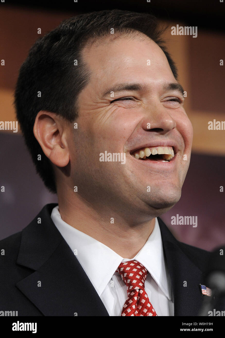 Sen. Marco Rubio (R-FL) laughs during a light-hearted moment as he makes remarks on a bi-partison plan to introduce immigration reform, at the US Capitol, January 28, 2013, in Washington, DC. The legislation follows the so-called *Dream Act*, a comprehensive path to citizenship for millions of illegal aliens in the US.  UPI/Mike Theiler Stock Photo