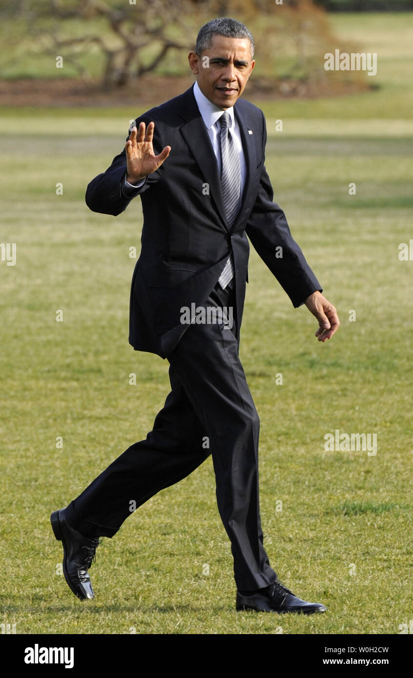 US President Barack Obama walks from Marine One helicopter as he returns to the White House after a day trip to the Argonne National Laboratory, on March 15, 2013 in Washington, DC. Obama delivered an address on energy and the environment at Argonne, Illinois.                          UPI/Mike Theiler Stock Photo