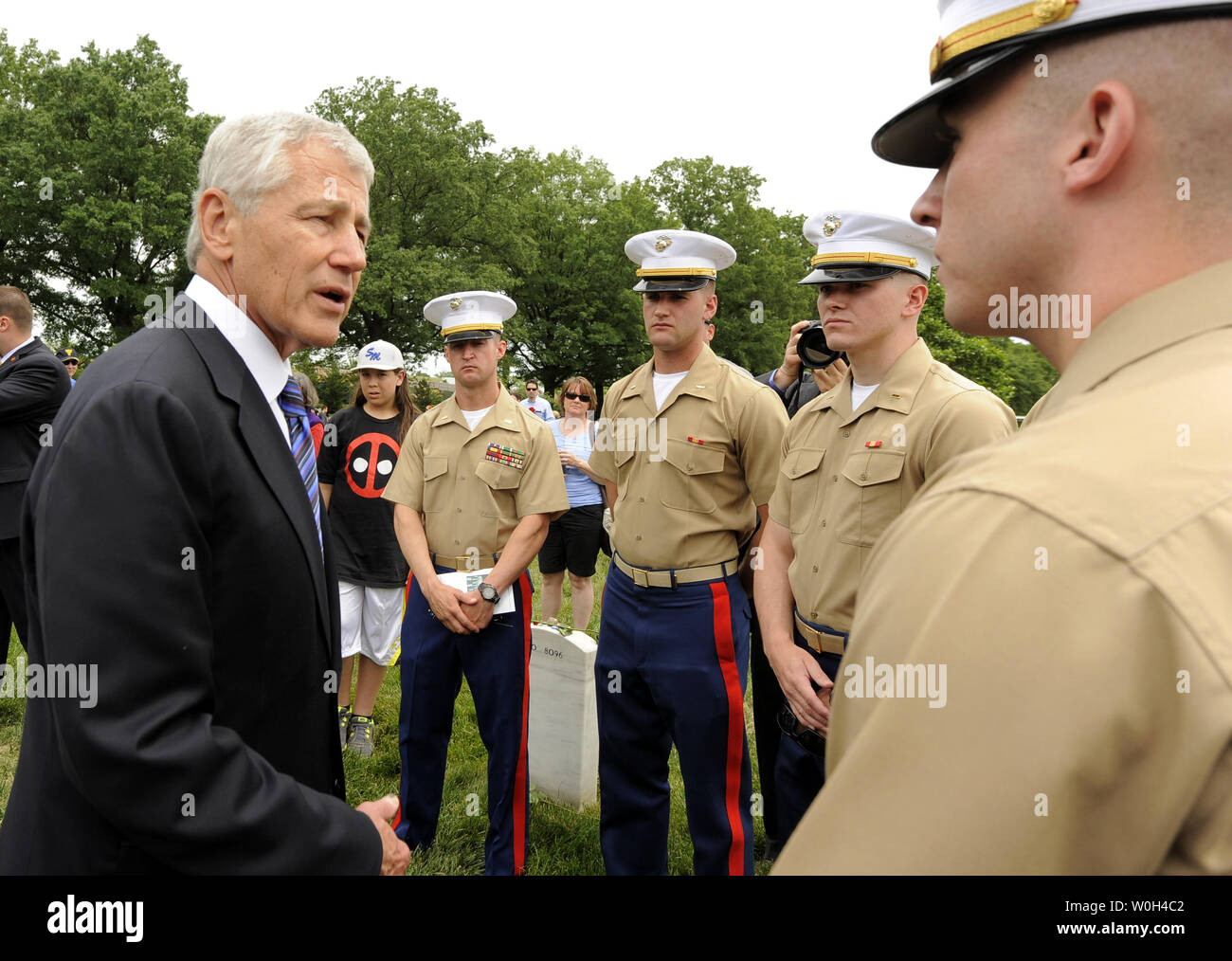 US Secretary of Defense Chuck Hagel (L) chats with a group of US Marines as he visits Arlington National Cemetery on Memorial Day, in Arlington, Virginia, May 27, 2013. On Memorial Day the nation honors its military veterans and those who have died in the country's conflicts. UPI/Mike Theiler Stock Photo