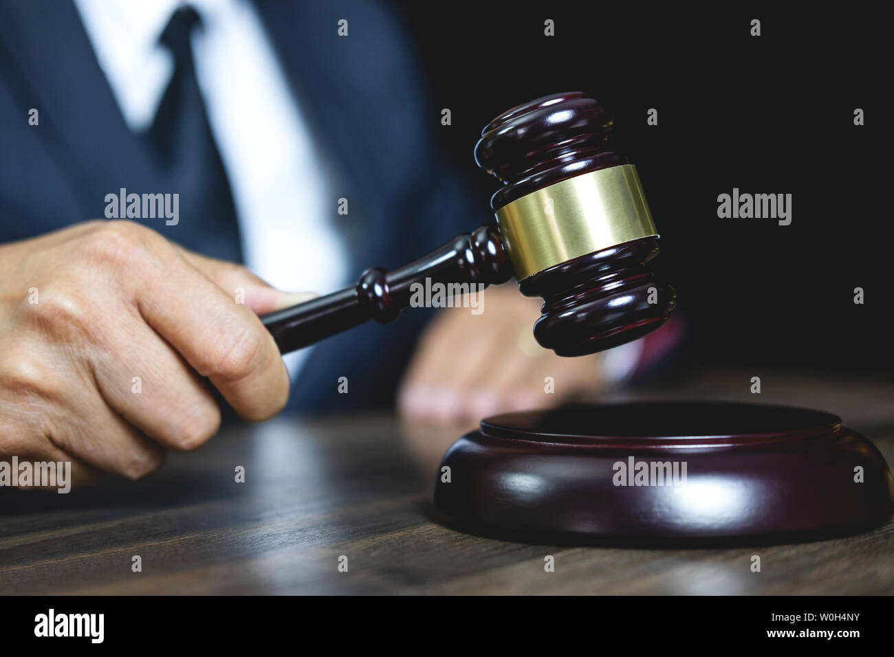 Legal law, advice and justice concept, male counseling lawyer or notary working on a documents and contract papers of the important case and wooden ga Stock Photo