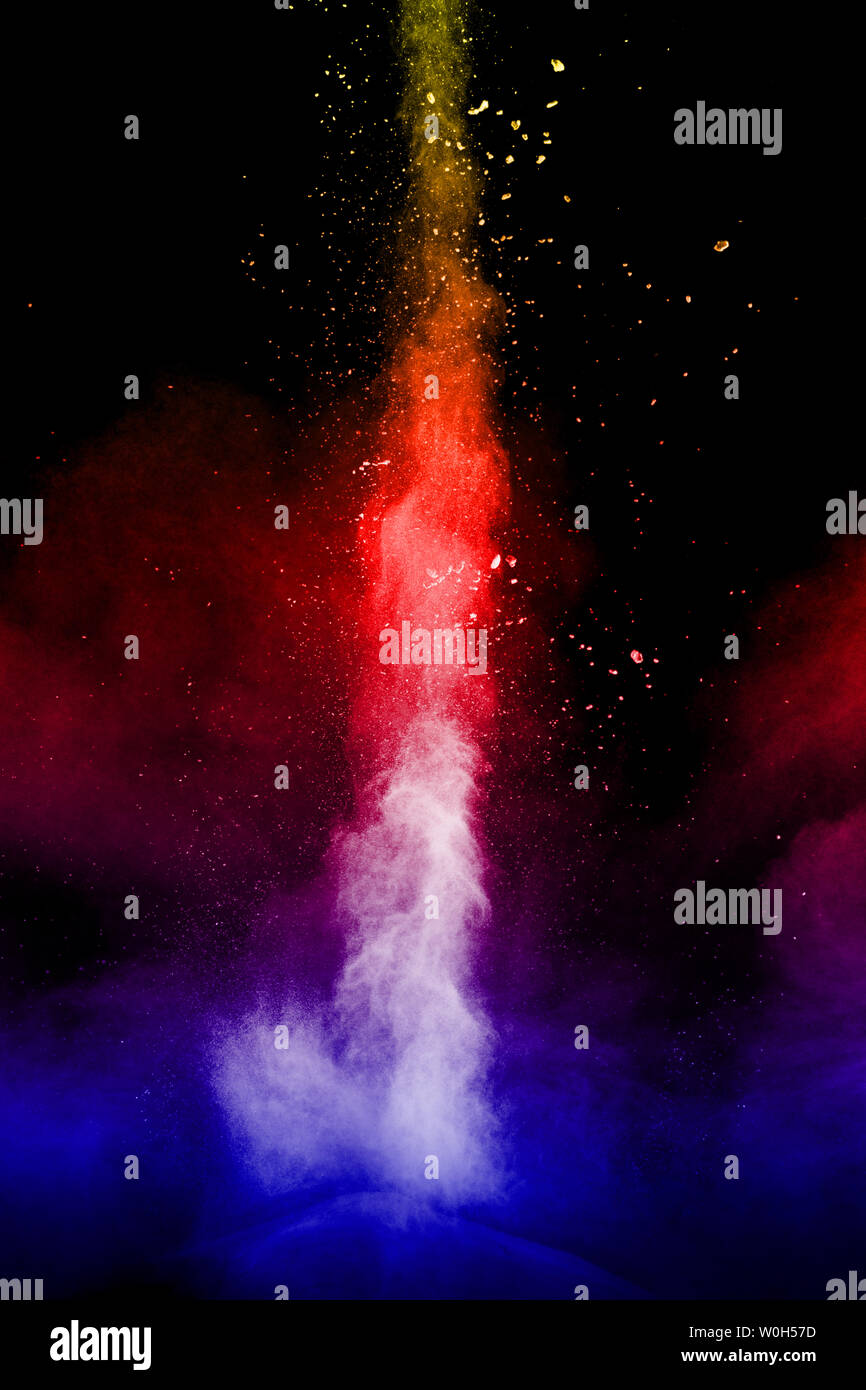 Multi color particles explosion on black background. Colorful dust ...