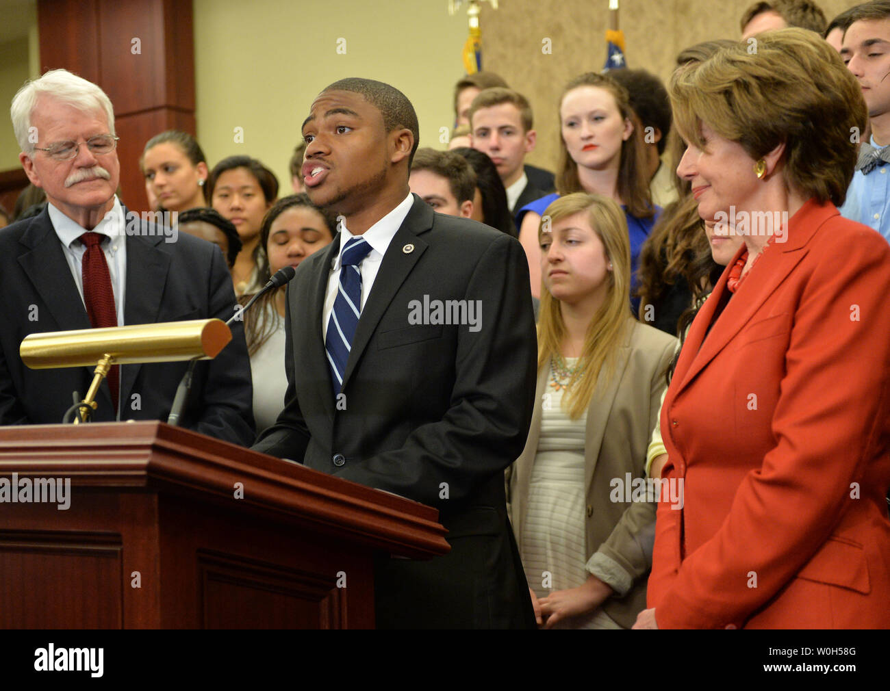 Sampson Armstrong, a student at Howard University, speaks on student loan interest rates, at a press conference on Capitol Hill in Washington, D.C. on June 20, 2013. Armstrong was joined by Rep. George Miller (D-CA) and House Minority Leader Nancy Pelosi (D-CA)  UPI/Kevin Dietsch Stock Photo