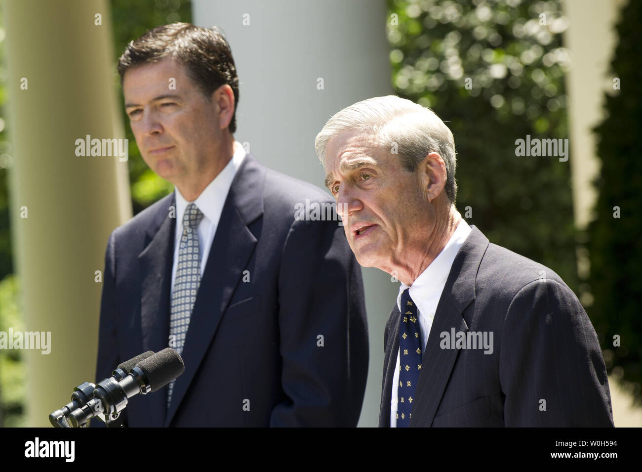 Outgoing FBI director Robert Mueller (R) delivers remarks alongside Presdient Obama's nominee to replace him James Comey, during a ceremony in the Rose Garden at the White House on June 21, 2013.  UPI/Kevin Dietsch Stock Photo