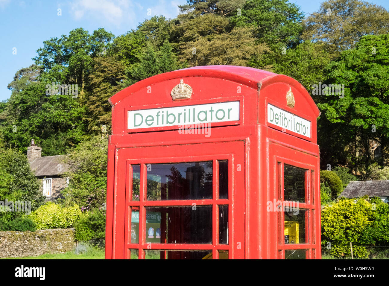 Defibrillator,inside,iconic,red,telephone,box,in,Grasmere,The Lake District National Park,The Lakes,Lake District,,Cumbria,north,England,GB,UK,reuse, Stock Photo