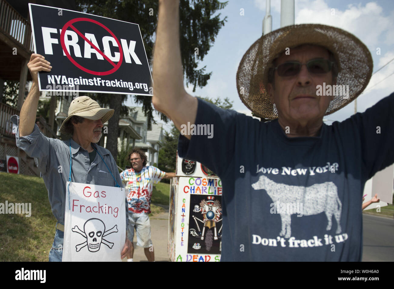 Demonstrators hold signs during a protest against fracking in Syracuse, New York on August 22, 2013. The group, New Yorkers Against Fracking, held the protest near a high school where President Barack Obama is schedule to speak.  UPI/Kevin Dietsch Stock Photo