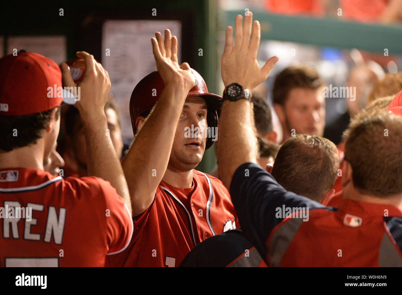 Teammates celebrate with New York Mets' Luis Guillorme, right