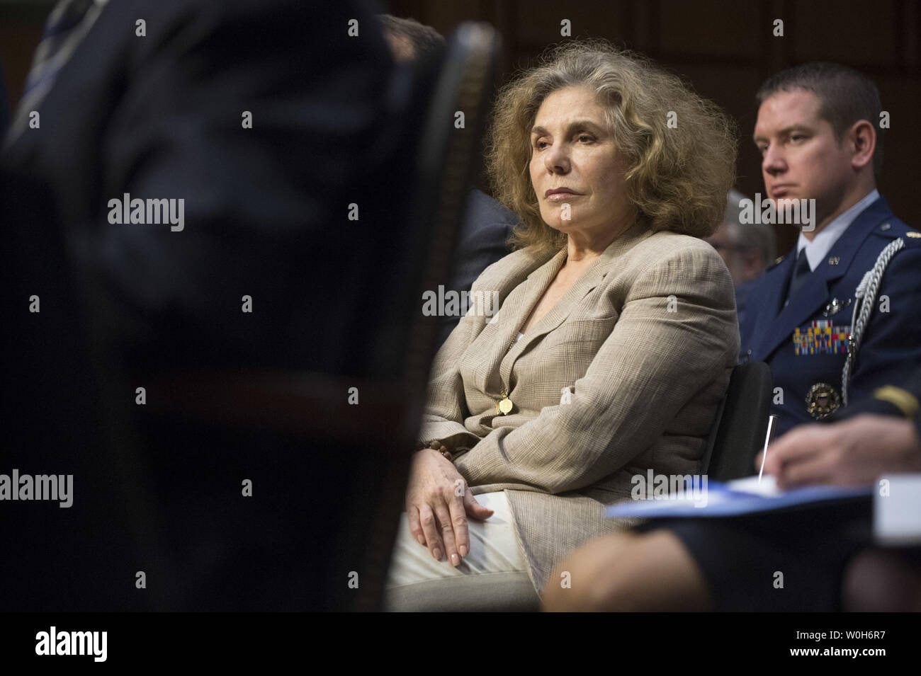 Teresa Heinz Kerry listens as her husband Secretary of State John Kerry