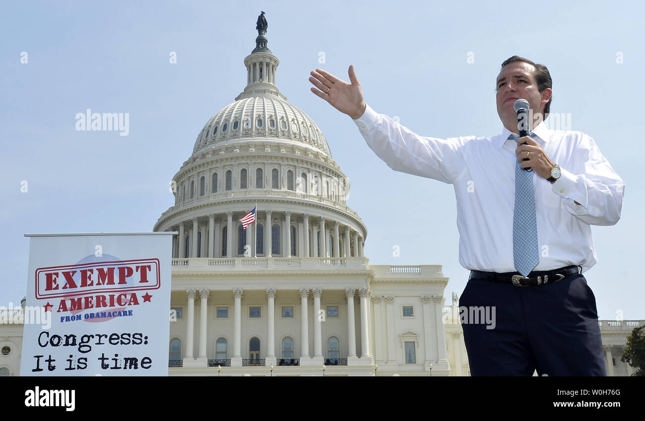 Sen. Ted Cruz (R-TX) speaks in front of the US Capitol at a Tea Party rally to push for de-funding Obamacare, The Affordable Care Act, on Capitol Hill, September 10, 2013, in Washington, DC.  Unable to override votes to defeat President Barack Obama's health care act, some Congressional Republicans are hoping to end funding for it.                 UPI/Mike Theiler Stock Photo