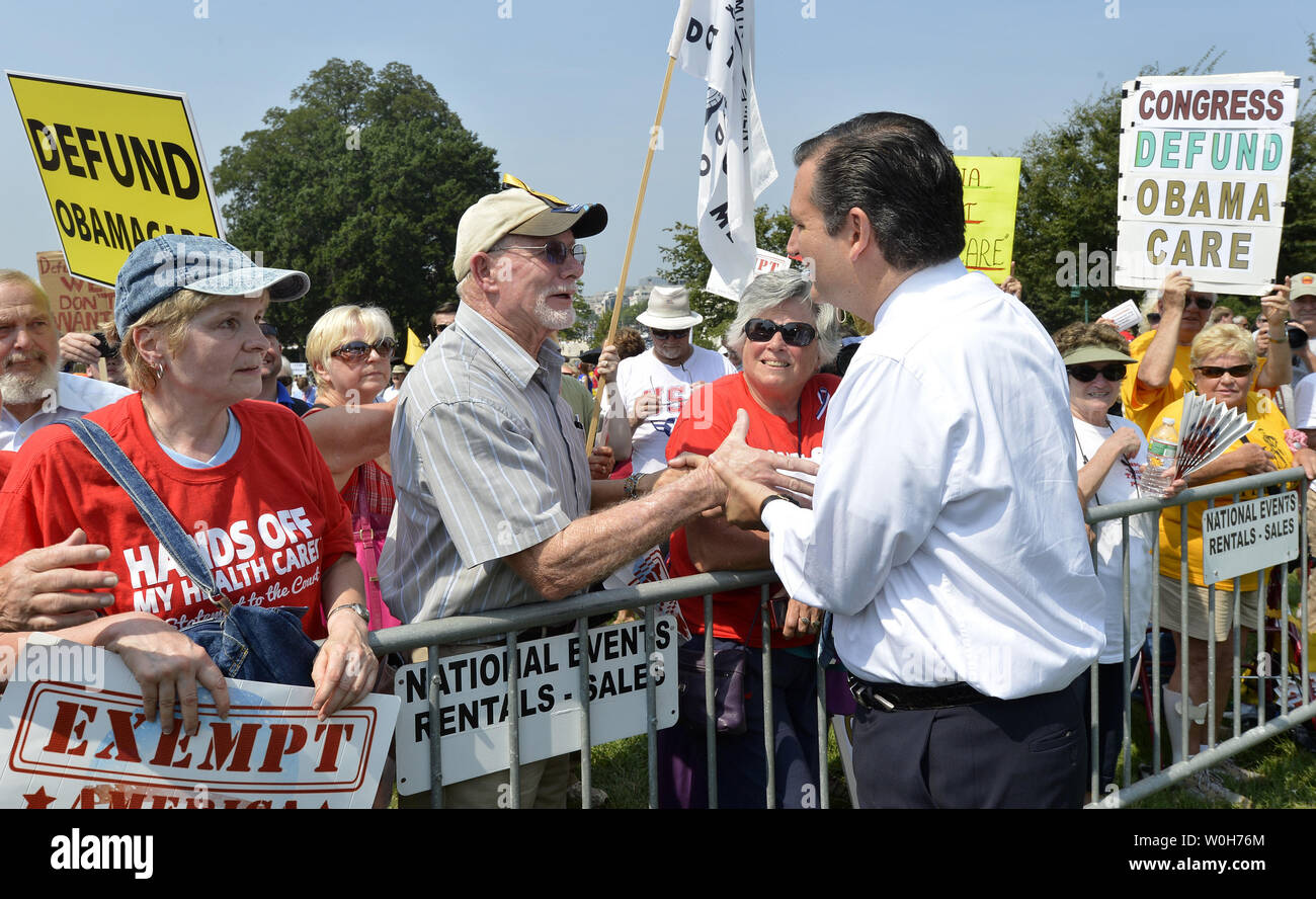Sen. Ted Cruz (R-TX) greets demonstrators in front of the US Capitol at a Tea Party rally to push for de-funding Obamacare, The Affordable Care Act, on Capitol Hill, September 10, 2013, in Washington, DC.  Unable to override votes to defeat President Barack Obama's health care act, some Congressional Republicans are hoping to end funding for it.                 UPI/Mike Theiler Stock Photo