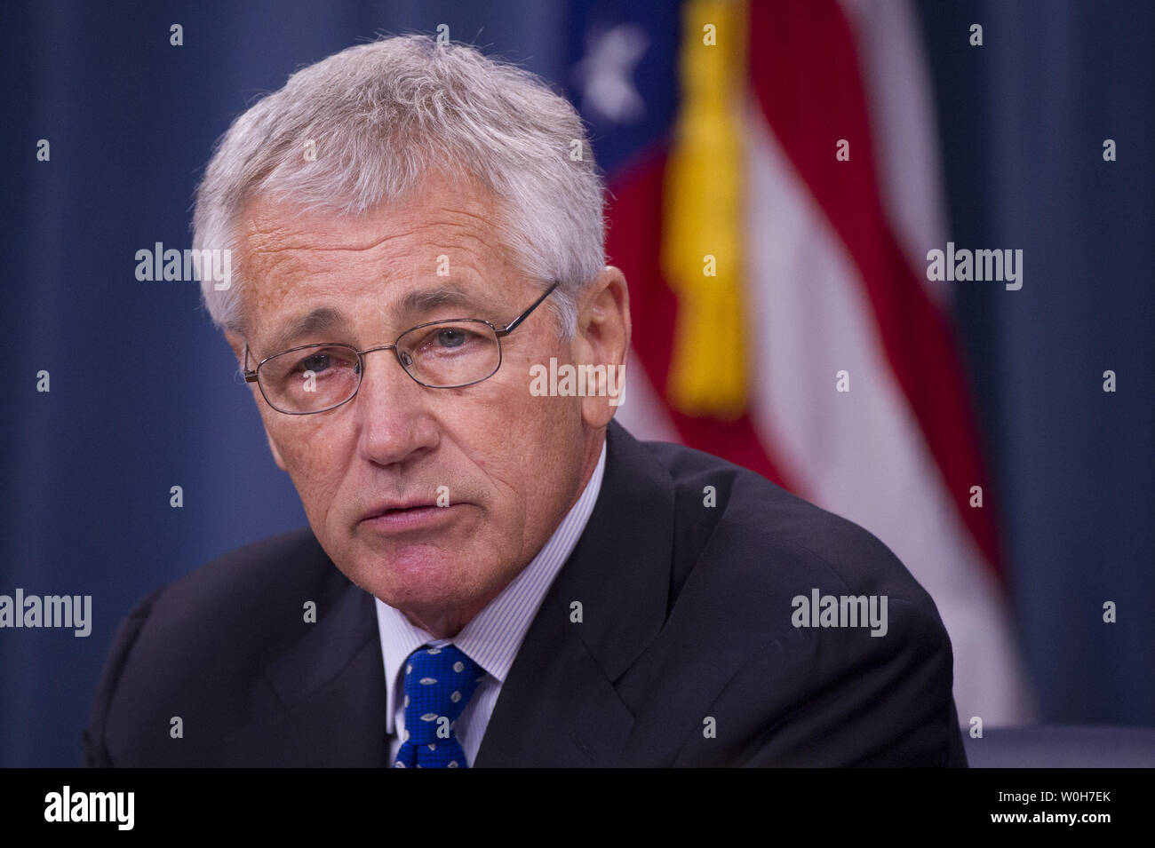 Defense Secretary Chuck Hagel speaks during a press briefing at the Pentagon in Arlington, Virginia on September 18, 2013.  Hagel is ordering reviews of security measures of U.S defense facilities worldwide and reviews of security clearance procedures. These reviews come in the wake of Monday's Navy Yard shooting that left 13 people dead including gunman Aaron Alexis, who was a Defense Department contractor with a security clearance.  UPI/Kevin Dietsch Stock Photo