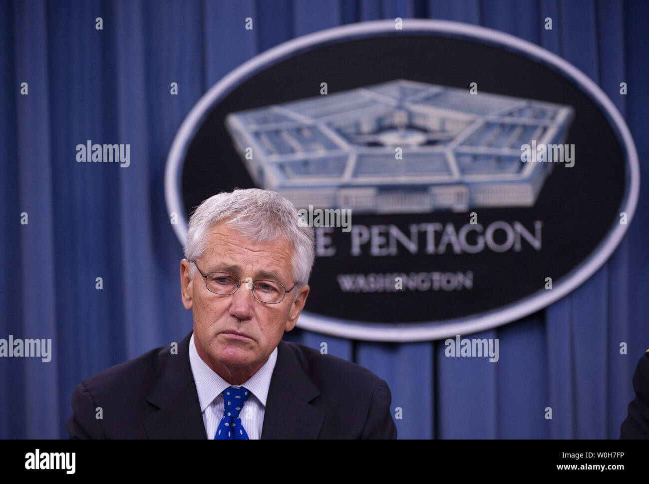 Defense Secretary Chuck Hagel speaks during a press briefing at the Pentagon in Arlington, Virginia on September 18, 2013.  Hagel is ordering reviews of security measures of U.S defense facilities worldwide and reviews of security clearance procedures. These reviews come in the wake of Monday's Navy Yard shooting that left 13 people dead including gunman Aaron Alexis, who was a Defense Department contractor with a security clearance.  UPI/Kevin Dietsch Stock Photo