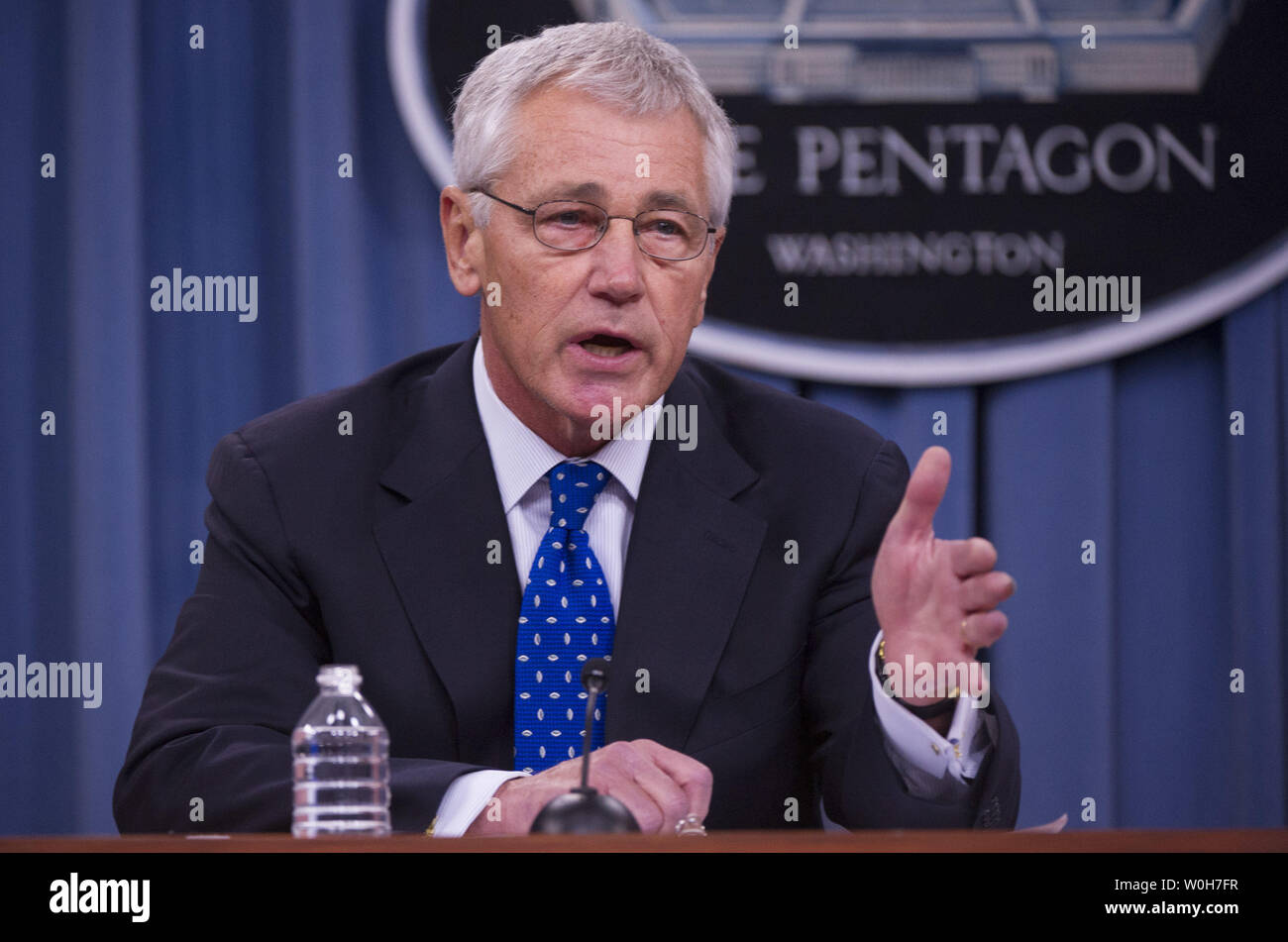 Defense Secretary Chuck Hagel speaks during a press briefing at the Pentagon in Arlington, Virginia on September 18, 2013.  Hagel is ordering reviews of security measures of U.S defense facilities worldwide and reviews of security clearance procedures. These reviews come in the wake of Monday's Navy Yard shooting that left 13 people dead including gunman Aaron Alexis, who was a Defense Department contractor with a security clearance.  UPI/Kevin Dietsch Stock Photo